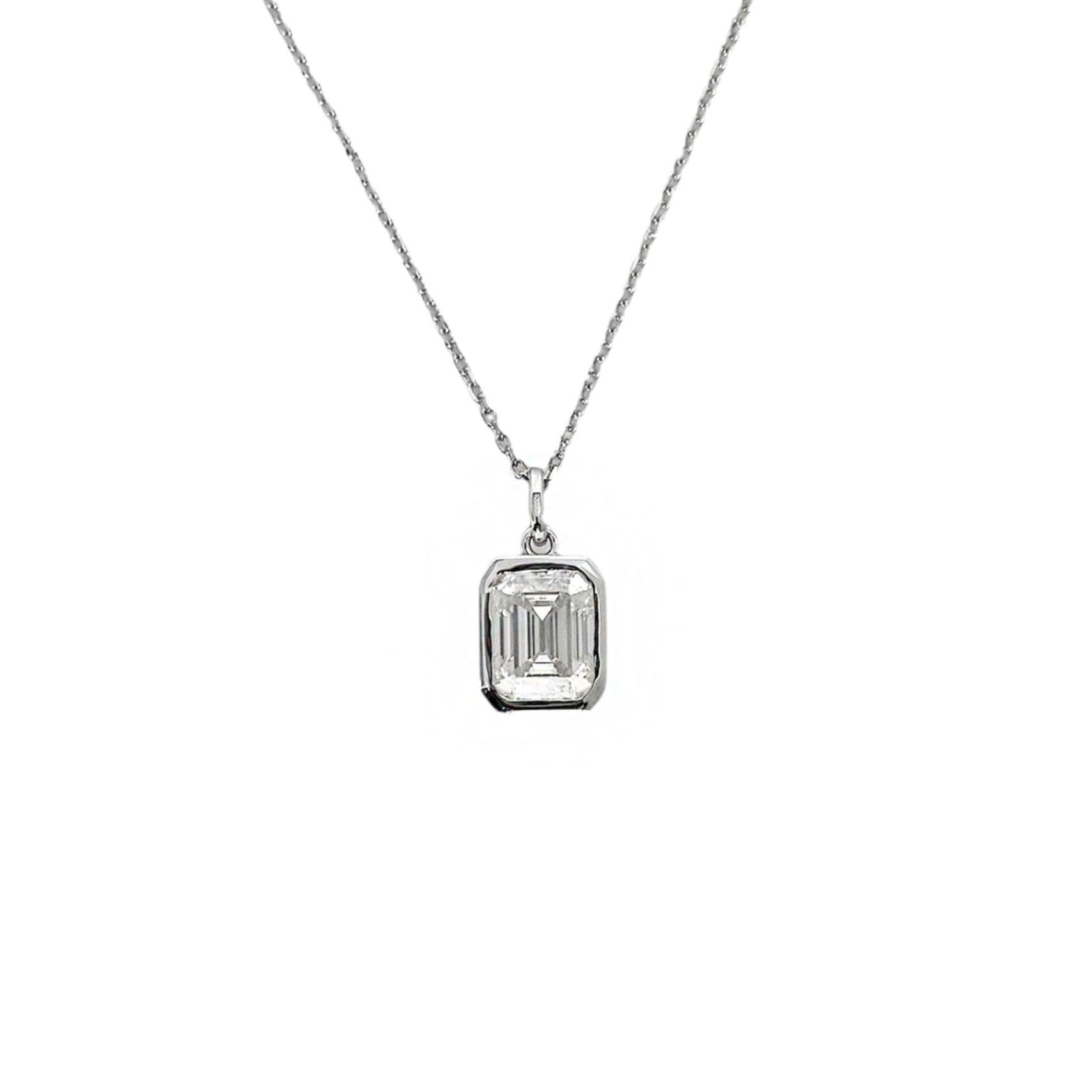 Silver necklace with a rectangular pendant on a white background